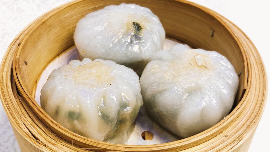 Steamed Green Leek Dumpling 韭菜餅 · Thin sticky layered dumpling wrapper that is steamed then pan-fried with freshly minced chive and shrimp filling