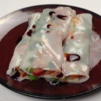 Rice Roll Noodle With Barbeque Pork 叉烧腸粉  · Minced barbequed pork wrapped in rice noodles then steamed, served with sweetened soy sauce ...