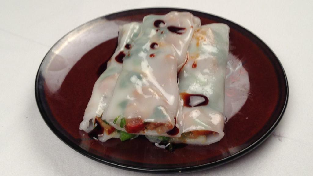 Rice Roll Noodle With Barbeque Pork 叉烧腸粉  · Minced barbequed pork wrapped in rice noodles then steamed, served with sweetened soy sauce and sesame oil on the side