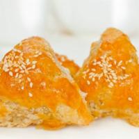 Baked Pork Pastries 叉烧酥 · Golden flaky pastry filled with barbeque pork and topped with sesame seeds
3 pieces