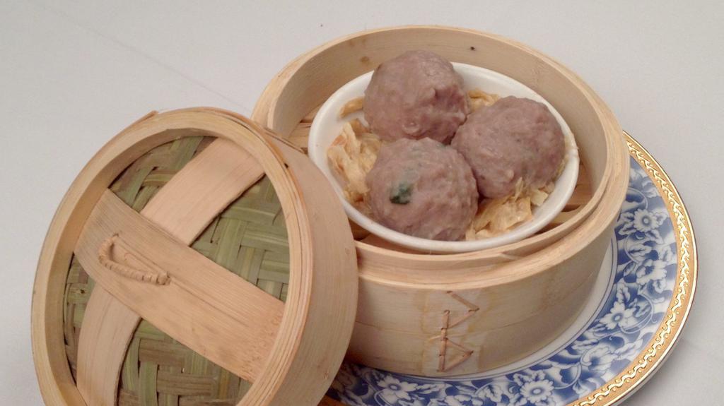 Steamed Beef Ball 牛肉丸  · Finely ground beef balls steamed with preserved orange peel, tofu skin, and herbs