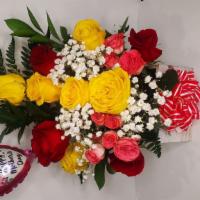 Beautiful Arrangement Wood Base With Red And Yellow Roses · Beautiful flower arrangement in wood base
