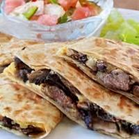 Steak Quesadilla · Steak and shredded melted cheese in a crispy flour tortilla and served with a side of pico d...
