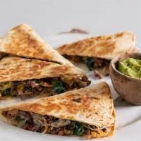 Ground Beef Quesadilla · Ground beef and shredded melted cheese in a crispy flour tortilla and served with a side of ...
