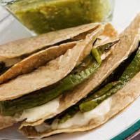 Papa Y Rajas Quesadilla · Diced potatoes, roasted poblano peppers, and shredded melted cheese in a crispy flour tortil...