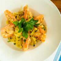 Shrimp Scampi  · white shrimp, tagliatelle pasta, english peas, white wine, garlic, basil