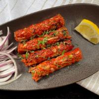 Raunak-E Seekh Kebab
 · minced lamb skewer w/ herbs and spices, tossed in a lamb sauce