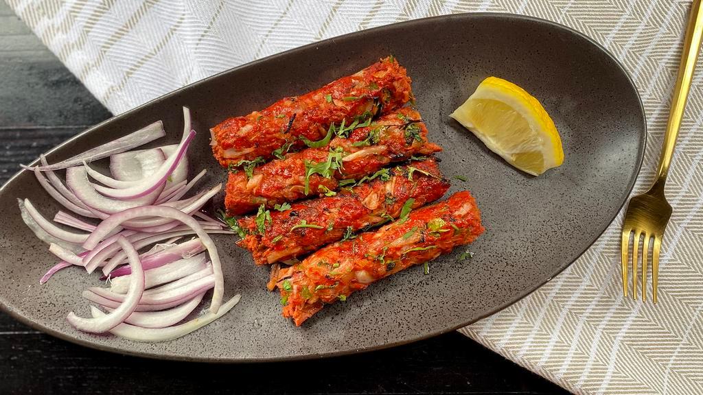 Raunak-E Seekh Kebab
 · minced lamb skewer w/ herbs and spices, tossed in a lamb sauce