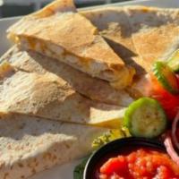 Chicken Quesadilla · Grilled chicken breast combined with melty cheese pressed between two warm tortillas.  It co...