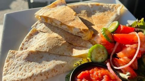 Chicken Quesadilla · Grilled chicken breast combined with melty cheese pressed between two warm tortillas.  It comes with chips.