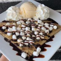 S'Mores Crêpe · A campfire-inspired crepe covered in chocolate chips, graham cracker crumbs, mini marshmallo...