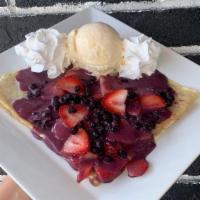 Berry Sauce Crepe · Sweet and tart, this crepe comes with fresh strawberries and blueberries and is covered in o...