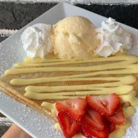 Mango Creme & Strawberry Crepe · A tasty tropical treat that comes with our mango crème and slices of fresh strawberries. Inc...