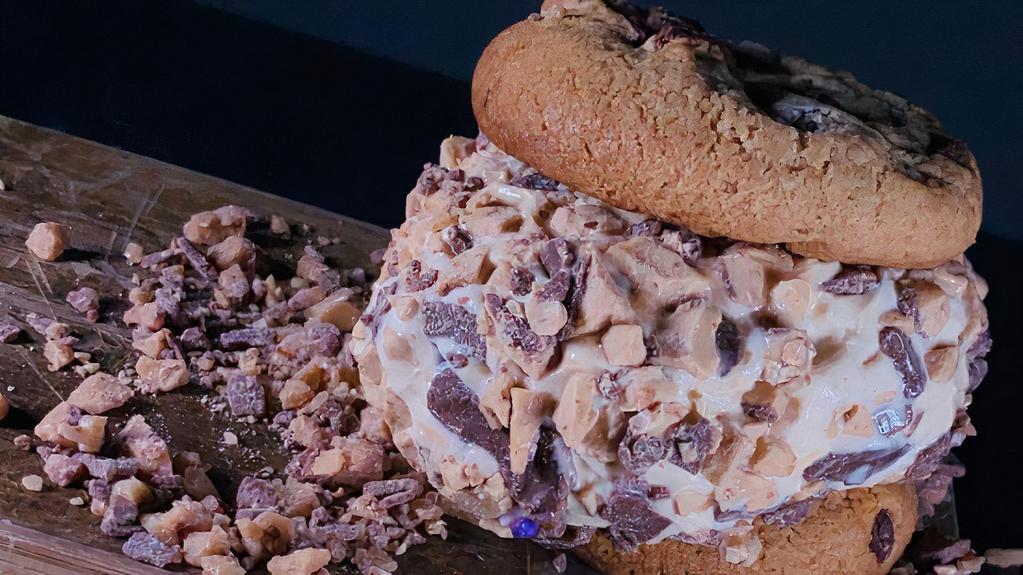 Dulce De Leche Cookie Sandwich · Two of our chocolate chip cookies with a scoop of dulce de leche ice cream and a toffee rim that fits in just right.