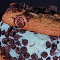 Mint Chip Cookie Sandwich · Two of our chocolate chip cookies with a scoop of mint chip ice cream and a chocolate chip r...