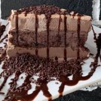 Chocolate Madness Ice Cream Cake · Ditch the crepe and try this twist on our Chocolate Cake Obsession. A slice of chocolate cak...