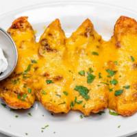 Idaho Potato Skins · Served with cheddar and bacon.