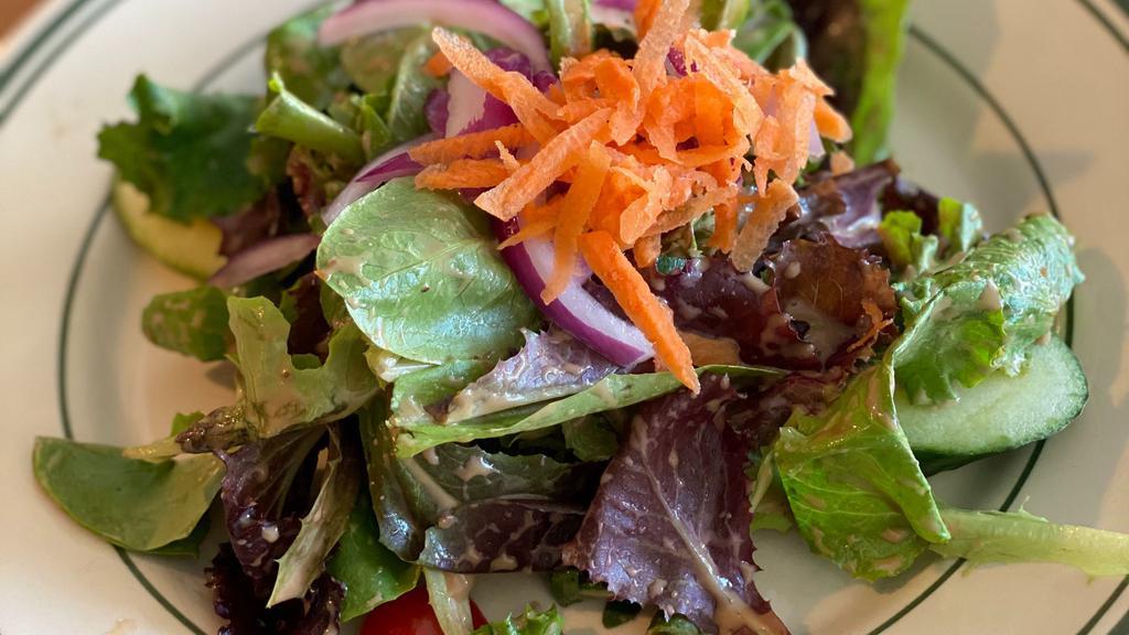House Salad · Gluten-free, vegetarian.  tomatoes | cucumbers | red onions | shredded carrots | vinaigrette dressing.