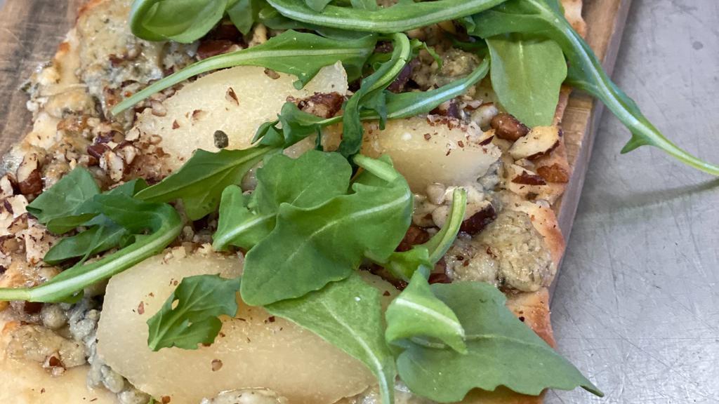 Poached Pear And Blue Cheese · Arugula | blue cheese | poached pear | pecans.