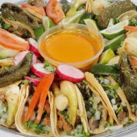 Taquiza · Platter of 20 Tacos. Comes with your choice of meat and accompanied by our signature sauces.