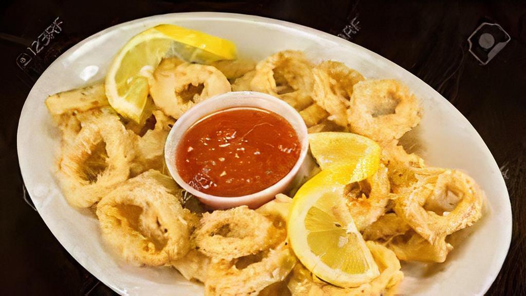 Fried Calamari Plate · Marinated jalapeño peppers, roasted red peppers, capers, manchego cheese, and lemon-caper aioli.