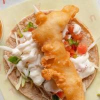 Baja Crispy Fish Taco · Crispy Baja Fried Fish. Served on authentically nixtamalized corn tortillas with thinly shre...
