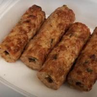 Chicken Seekh Kabab (2 Pieces) · Served with chutney.