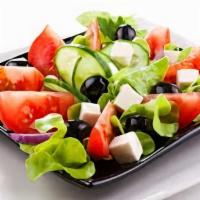 Greek Salad · Our famous salad with iceberg lettuce, tomatoes, cucumbers, onions, green peppers, feta chee...