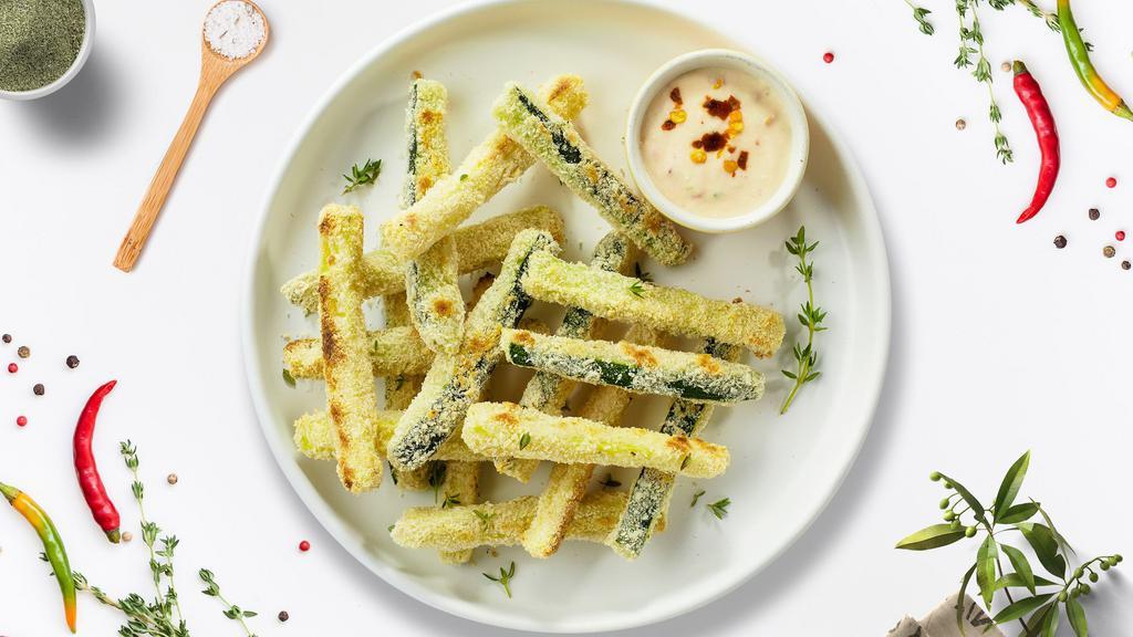 Super Zucchini Sticks · Zucchini sticks dipped in an egg mixture with bread crumbs, parmesan cheese, baking powder and fried until golden brown. Seasoned with seasalt.
