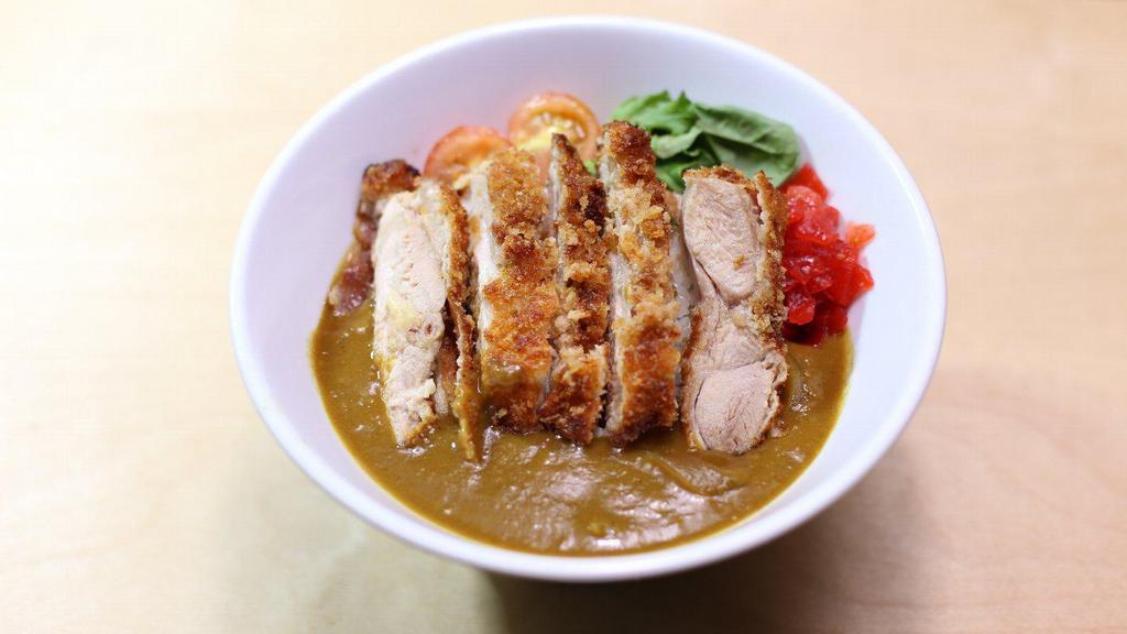 Japanese Premium Curry Rice Chicken Katsu · Homemade japanese curry over rice with breaded fried chiken.