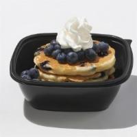 Double Blueberry  · 4 blueberry pancakes with more fresh blueberries and whipped topping
