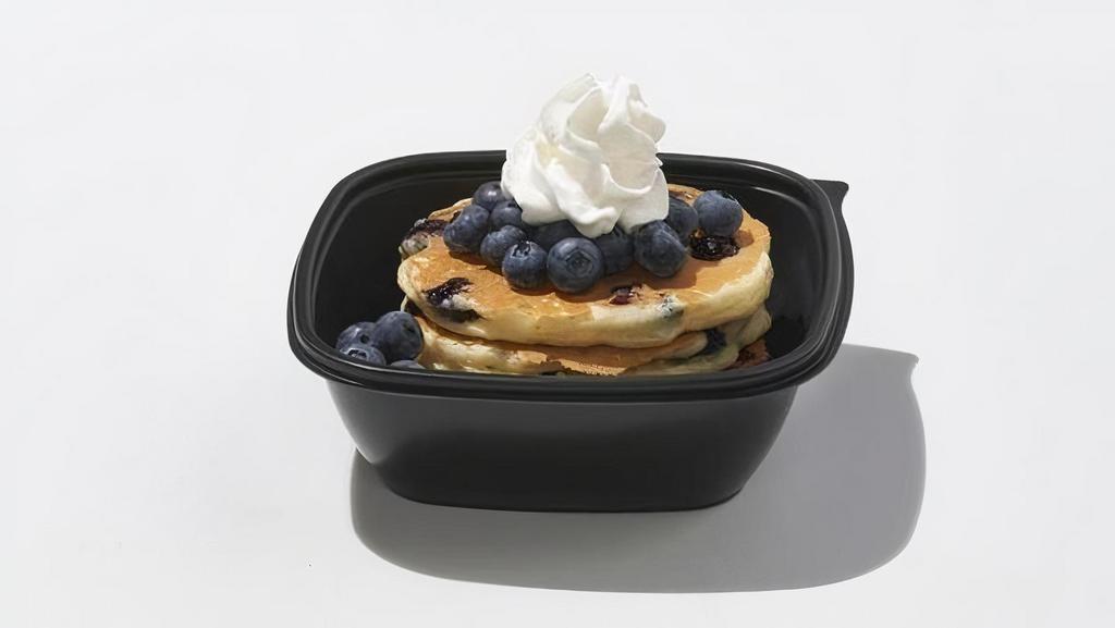 Double Blueberry  · 4 blueberry pancakes with more fresh blueberries and whipped topping