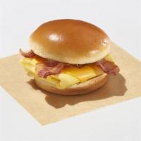 The Classic · Choice of hickory-smoked bacon or sausage patty and American cheese served with fluffy folde...