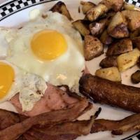 2 Eggs Any Style With Ham, Bacon And Sausage · Served with Home fries and toast.