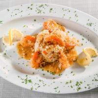 Shrimp Scampi · Sauteed in a fresh parsley garlic butter sauce and served over rice. With soup or house sala...