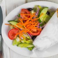L10 Falafel Pita With Garden Salad · Falafel pita served with Garden  Salad, choice of dressing