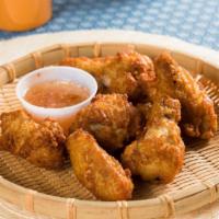 Chicken Wings · Crispy fried chicken wings with sweet chili sauce.