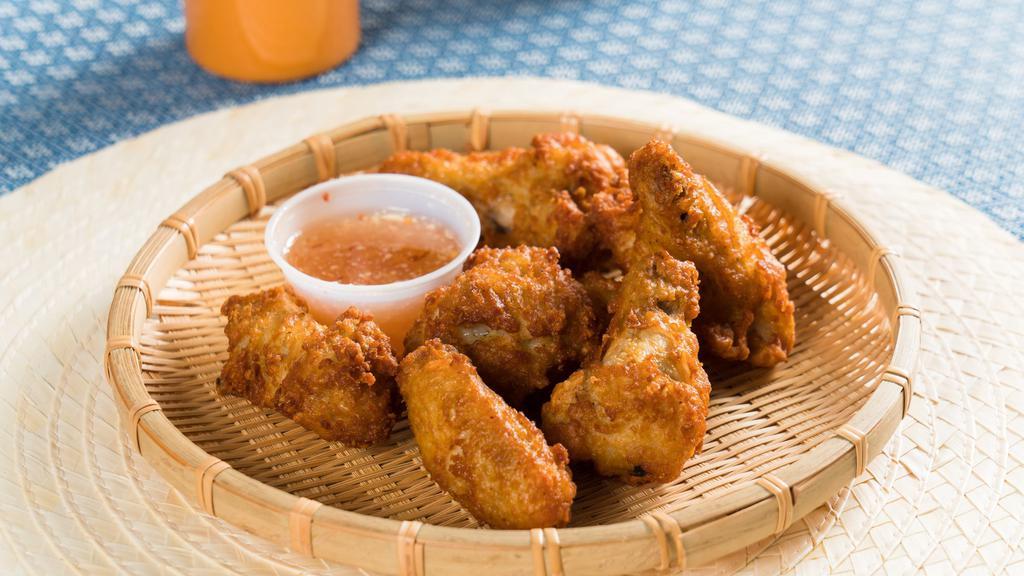 Chicken Wings · Crispy fried chicken wings with sweet chili sauce.