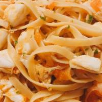 Homemade Fettucine Seafood  · Fresh homemade fettucine pasta with shrimp, crabmeat, lobster, and light tomato sauce.