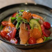 Sashimi Salad · Sliced of salmon, tuna, yellowtail, ikura, arugula, and mixed green vegetable, cucumber, che...