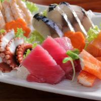 Scallop Sashimi · Fresh scallop sashimi slices.