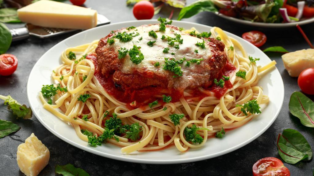 Veal Parmigiana · Veal Scallopini and mozzarella cheese, served over Customer's choice of pasta with marinara sauce.