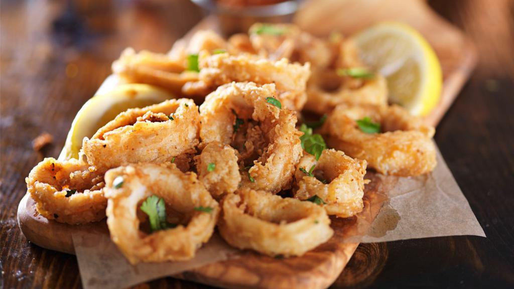 Fried Calamari · Fried Calamari served over Customer's choice of pasta with marinara sauce.
