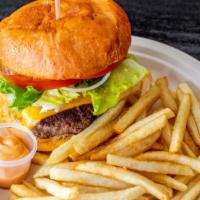 Traditional Burger · Angus beef, tomato mayo sauce, lettuce, tomatoes, onions pickles.