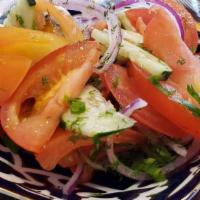 Fresh Salad · Tomatoes, cucumbers, greens, olive oil.