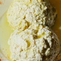 Labneh · Contains nuts. Home-made sour cream with walnuts, fresh herbs & garlic.