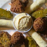 Istanbul Sampler · Includes 3 pieces of cheese rolls, 3 pieces of falafel, 3 pieces of stuffed grape leaves & 3...