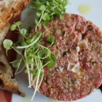 Filet Mignon Steak Tartare · Hand-cut fillet, chives, cooked egg, and capers. Consuming raw or undercooked meats, poultry...