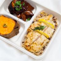 Lemon Herb Chicken Market Plate · Includes two sides on a bed of grains.