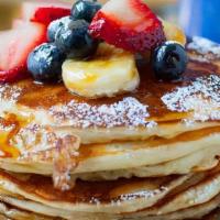 Pancakes · Eggs bacon juice or coffee. huevos tocino caffe .